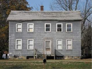 The farmhouse needed a new look as seen here in a photo taken before the remodeling began last year. (Photo by Brian Halprin)