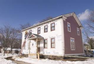 Jimmy Lowe's 1840s Greek Revival farmhouse on Seven Mile Road receives a facelift from Green Building Services to make the building more energy efficient, yet maintain its historical integrity. (Bill Bresler | staff photographer)